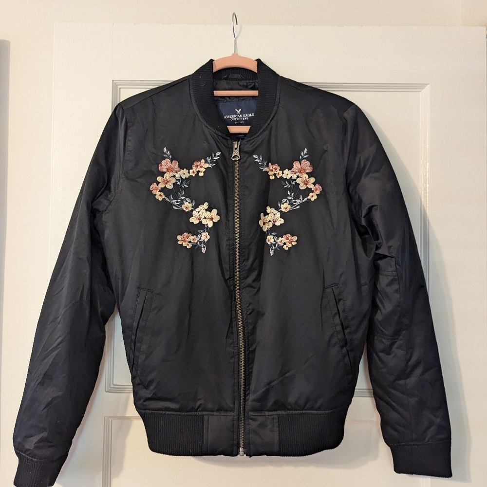 Black American Eagle Bomber Jacket with floral detail - Size Medium